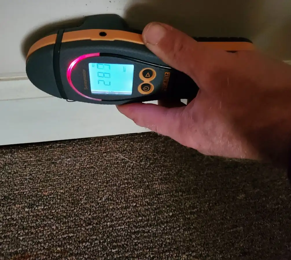 Moisture detection at baseboard during Storm Damage Restoration in Highgrove
